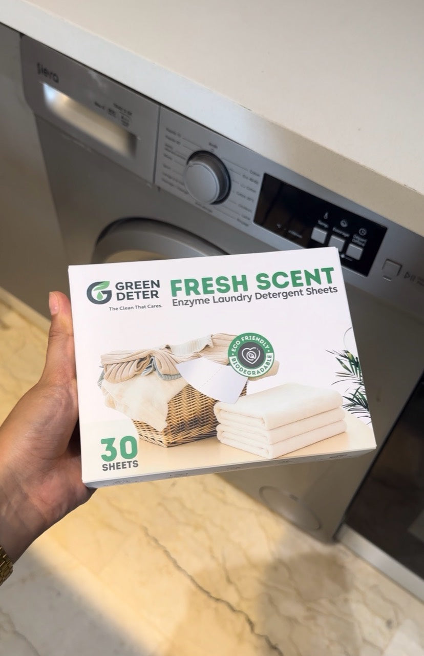 علبة GREEN DETER أمام الغسالة